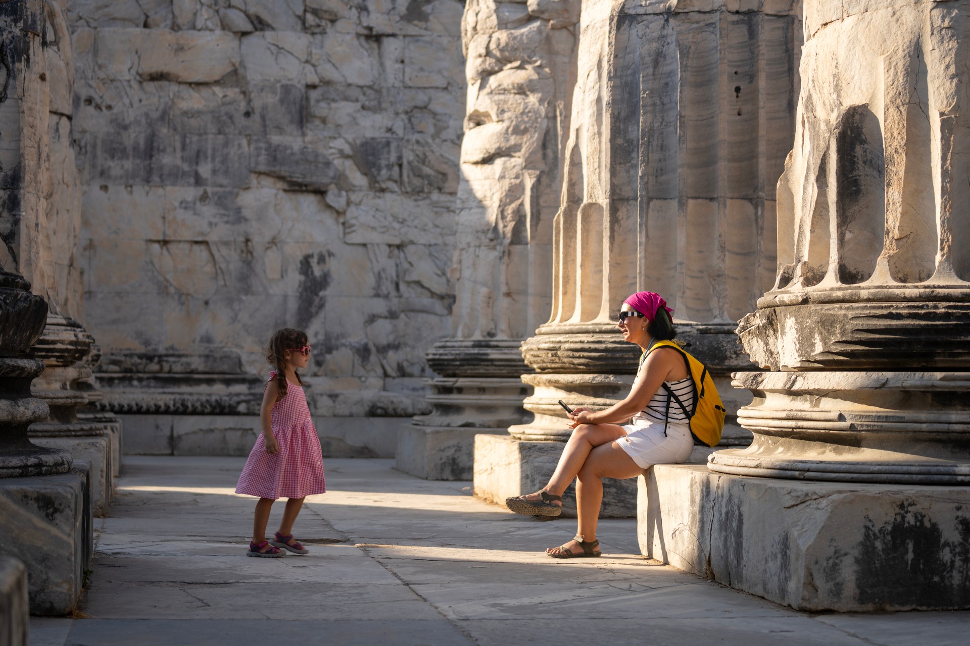 Photo of mother and daughter exploring ancient Greek City